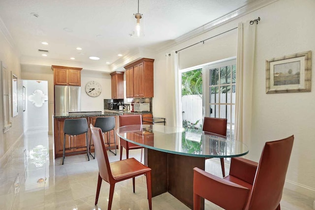 dining area featuring visible vents, recessed lighting, and crown molding