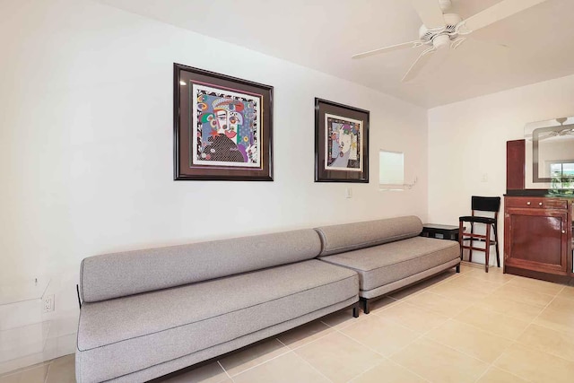 living room with light tile patterned floors and ceiling fan