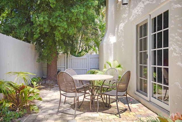 view of patio / terrace with outdoor dining area and fence