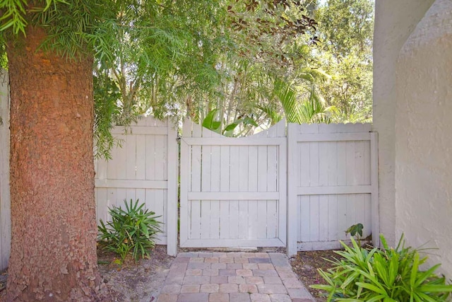 view of gate with fence