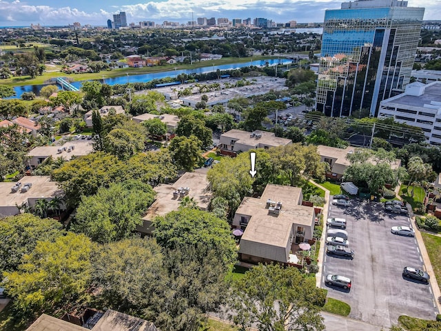 drone / aerial view featuring a view of city and a water view