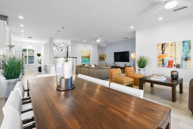 dining area with recessed lighting, ceiling fan with notable chandelier, and visible vents