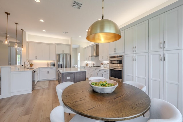 dining room with recessed lighting, visible vents, and light wood finished floors