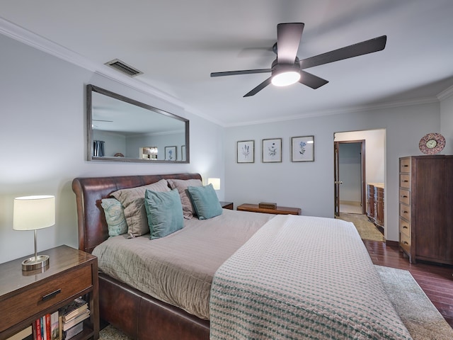 bedroom with ceiling fan, visible vents, dark wood finished floors, and crown molding