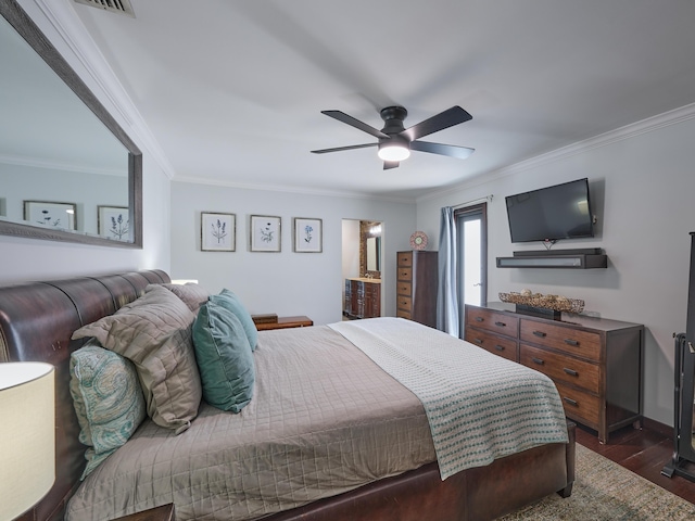 bedroom with dark wood-style floors, visible vents, ornamental molding, and ceiling fan