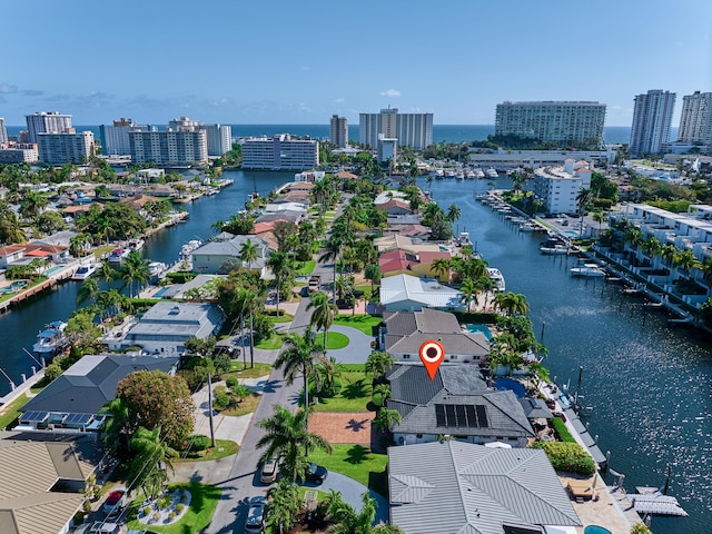 bird's eye view featuring a water view and a view of city