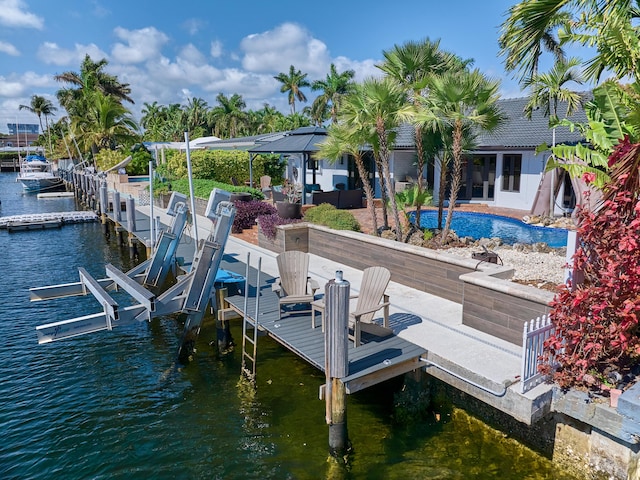 view of dock featuring a water view and boat lift