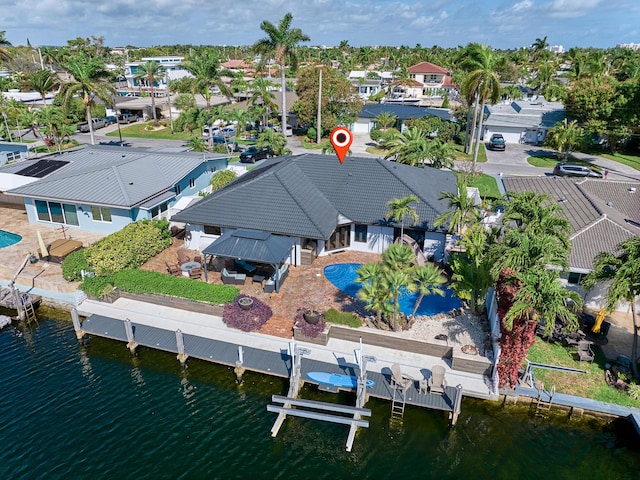 bird's eye view featuring a water view and a residential view