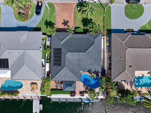 bird's eye view featuring a water view and a city view