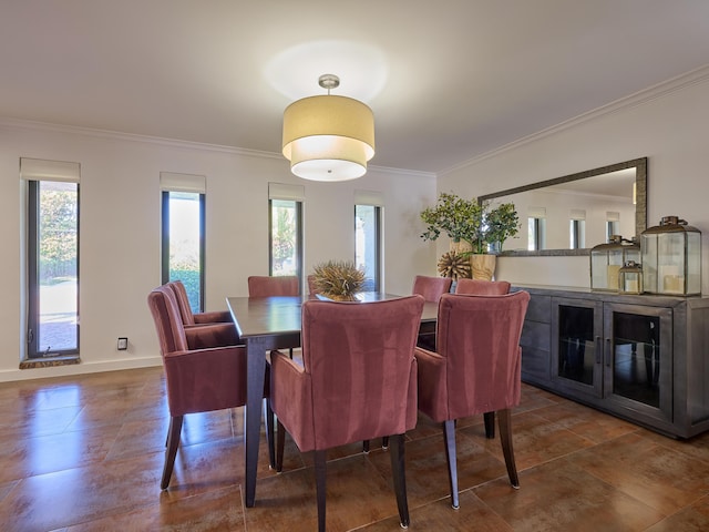 dining area featuring ornamental molding and baseboards