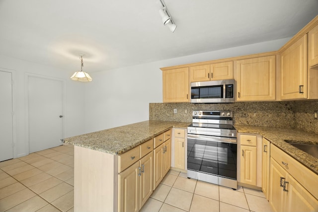 kitchen featuring a peninsula, light tile patterned floors, light brown cabinets, and appliances with stainless steel finishes