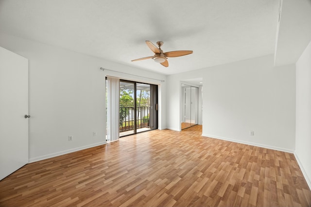 unfurnished room featuring light wood-type flooring, ceiling fan, and baseboards