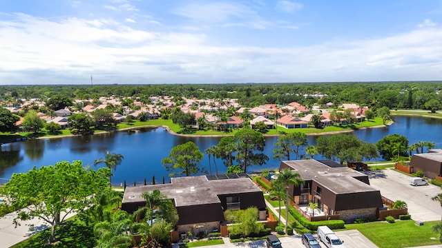 birds eye view of property with a water view and a residential view