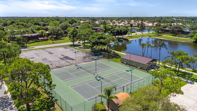 birds eye view of property with a water view