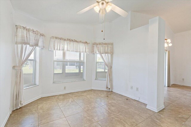 unfurnished sunroom featuring a ceiling fan