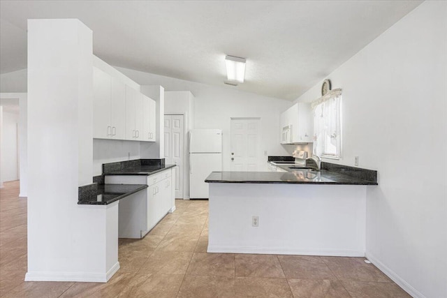 6625 Alheli Ct, Fort Pierce, FL 34951 - kitchen with vaulted ceiling, a peninsula, white cabinets, white appliances, and a sink