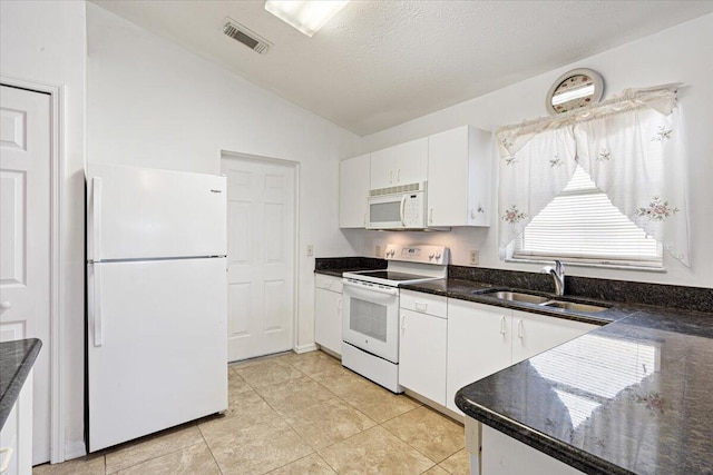 6625 Alheli Ct, Fort Pierce, FL 34951 - kitchen featuring vaulted ceiling, white appliances, white cabinetry, and a sink