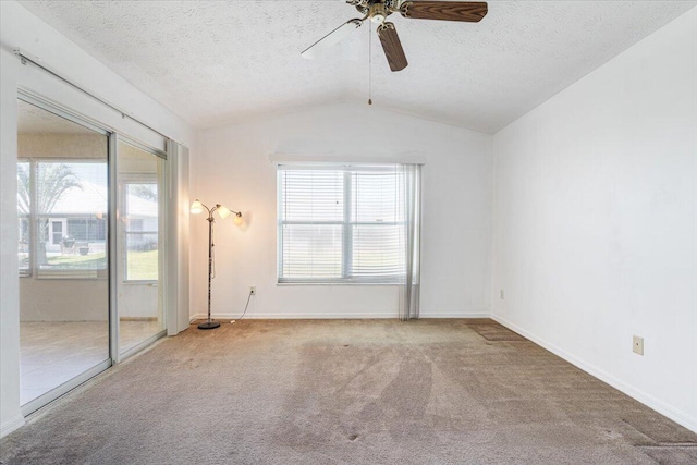 6625 Alheli Ct, Fort Pierce, FL 34951 - empty room with lofted ceiling, carpet, ceiling fan, and a textured ceiling