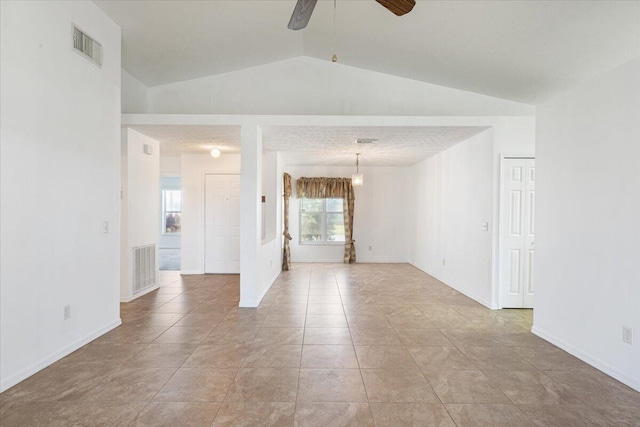6625 Alheli Ct, Fort Pierce, FL 34951 - spare room featuring visible vents, lofted ceiling, ceiling fan, and light tile patterned flooring