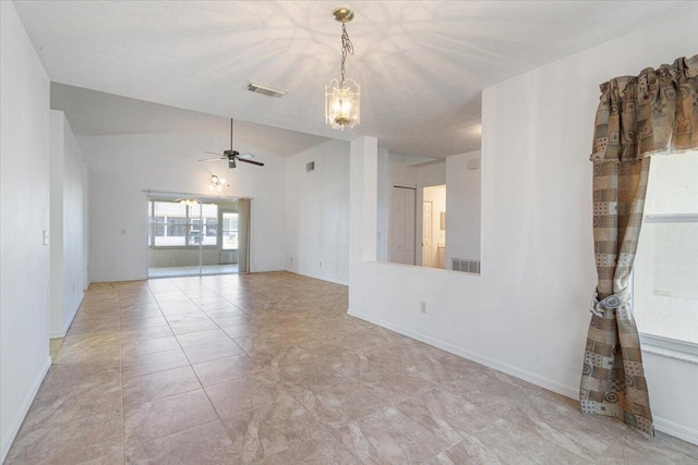6625 Alheli Ct, Fort Pierce, FL 34951 - empty room with visible vents, ceiling fan with notable chandelier, baseboards, and vaulted ceiling