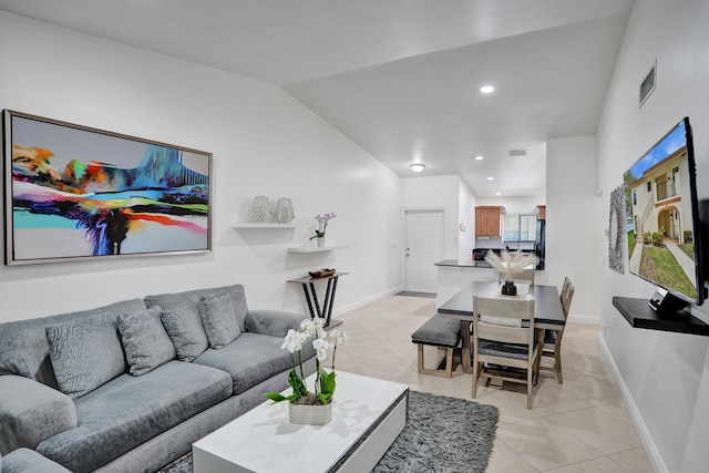 living room with light tile patterned floors, visible vents, baseboards, and recessed lighting