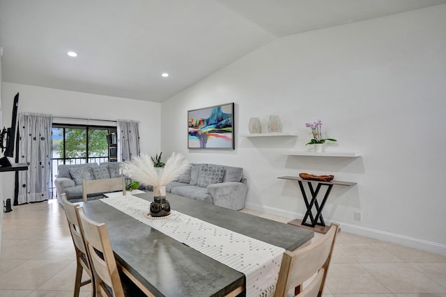 dining area with light tile patterned floors, recessed lighting, baseboards, and vaulted ceiling