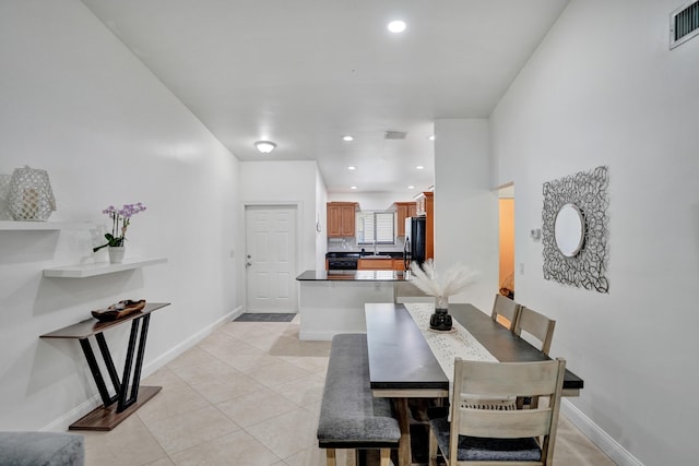 dining room featuring light tile patterned floors, visible vents, recessed lighting, and baseboards