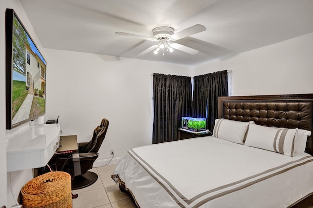 bedroom featuring light tile patterned floors, ceiling fan, and baseboards