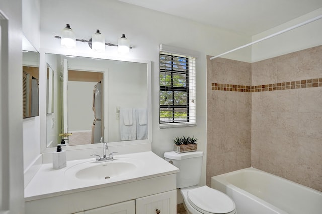 bathroom featuring vanity, toilet, and tub / shower combination