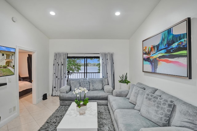 living area featuring light tile patterned floors, recessed lighting, and baseboards