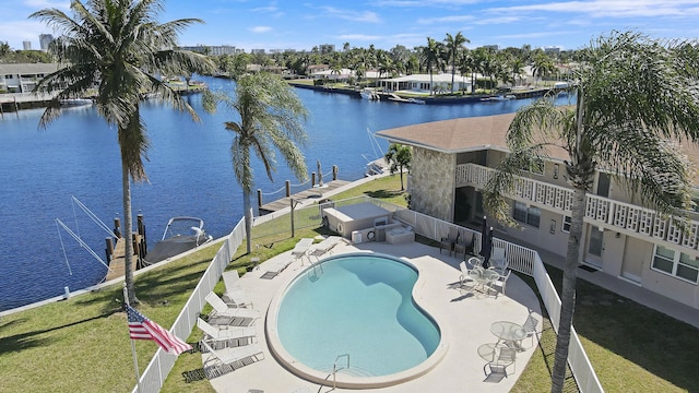 birds eye view of property with a water view