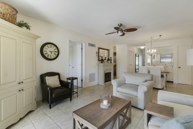 living room with visible vents, a fireplace, and light tile patterned floors