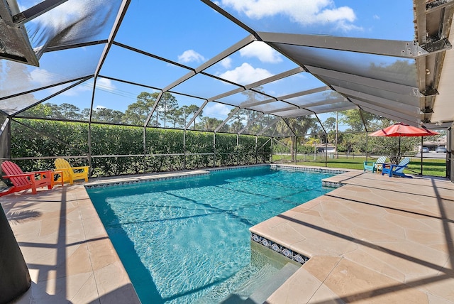 pool featuring a lanai and a patio