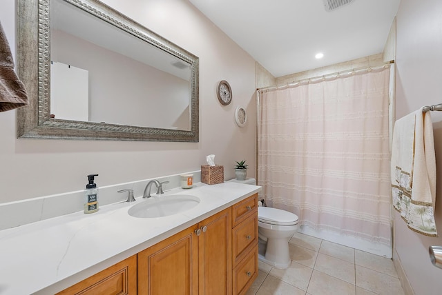 full bathroom featuring vanity, a shower with shower curtain, visible vents, tile patterned floors, and toilet