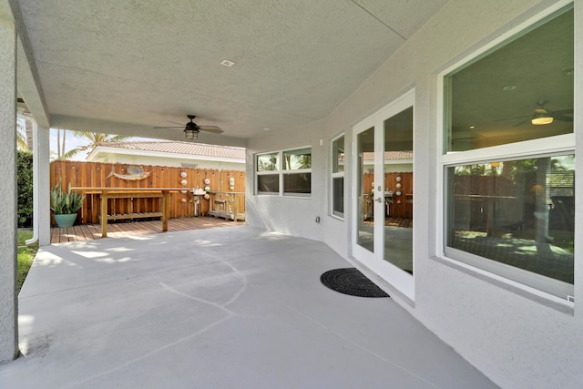 view of patio with ceiling fan and french doors