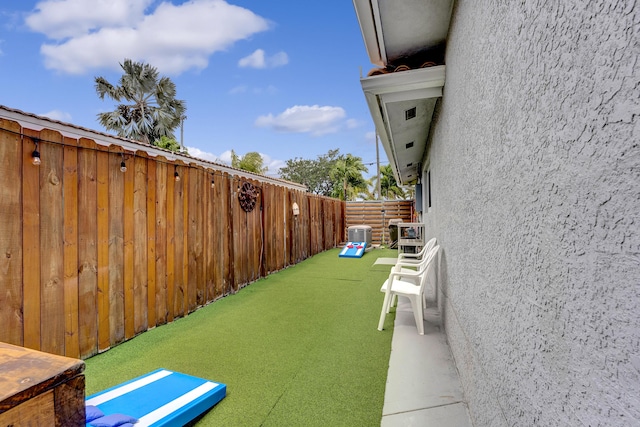 view of yard with fence private yard and central AC