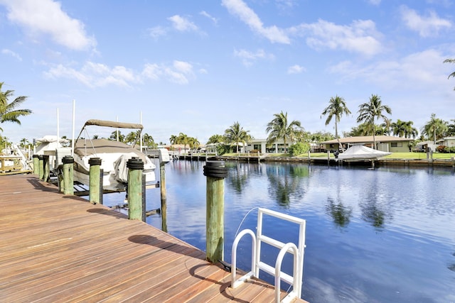 view of dock featuring a water view and boat lift