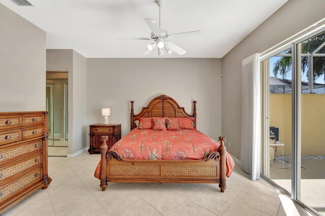 bedroom featuring light tile patterned floors, access to outside, baseboards, and ceiling fan