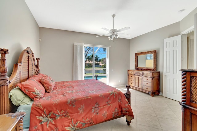 bedroom featuring access to exterior, ceiling fan, and light tile patterned floors