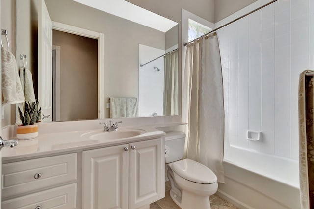 full bath featuring vanity, shower / bath combo with shower curtain, and toilet