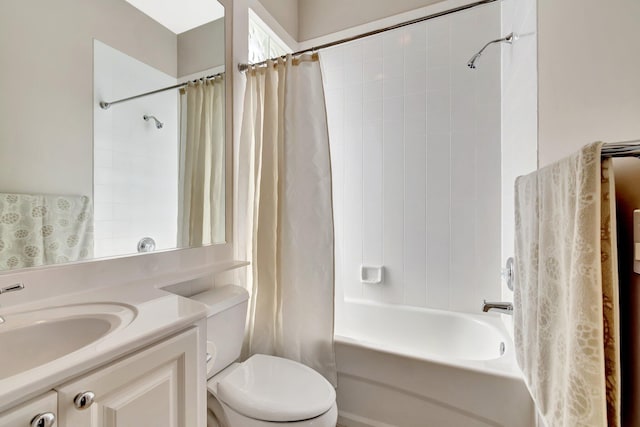 bathroom with toilet, vanity, and shower / tub combo with curtain