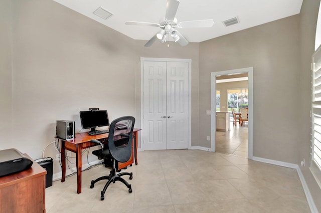 office with a ceiling fan, visible vents, baseboards, and light tile patterned floors