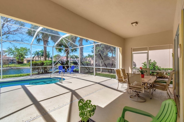 unfurnished sunroom with a water view and plenty of natural light