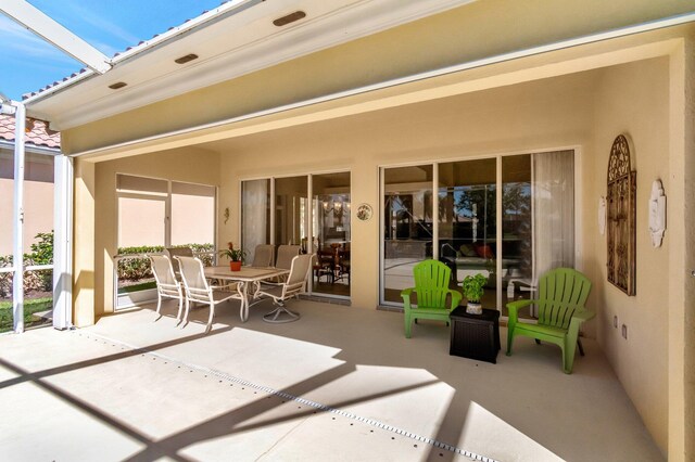 view of patio / terrace with glass enclosure