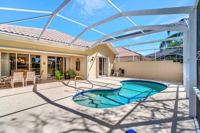 outdoor pool featuring a patio area and a lanai