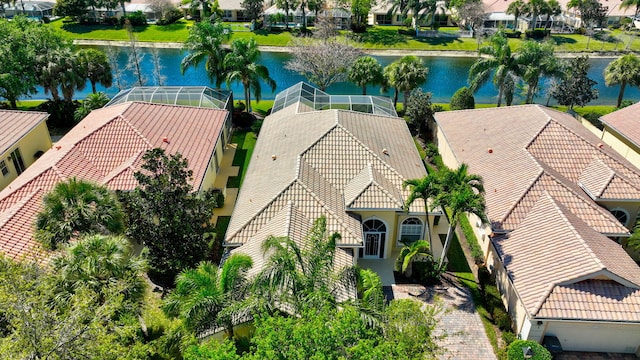 birds eye view of property featuring a water view and a residential view