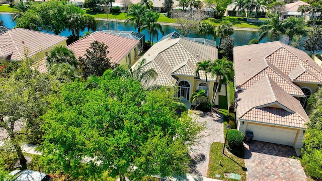 drone / aerial view featuring a residential view and a water view