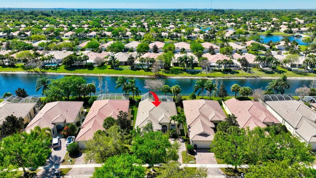 bird's eye view featuring a water view and a residential view