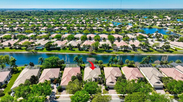 bird's eye view with a water view and a residential view