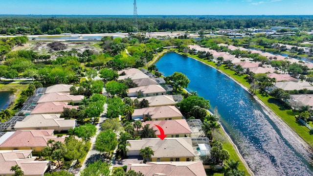 birds eye view of property with a residential view and a water view